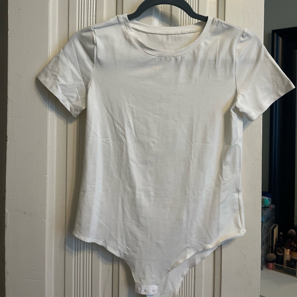 White bodysuit from Amazon. Never worn.
